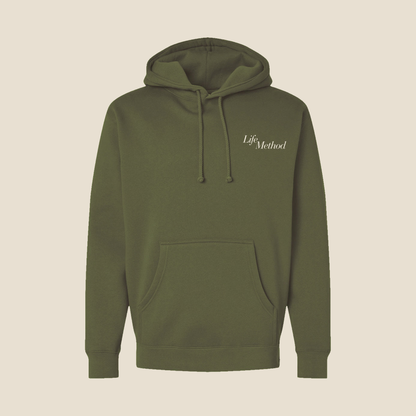 Front of the Life Method Army Green hoodie with a small cream Life Method script on the left chest