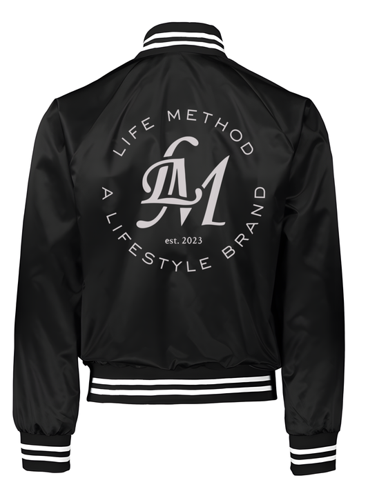 Life Method satin jacket in black, back view with large Life Method A Lifestyle Brand LM crest